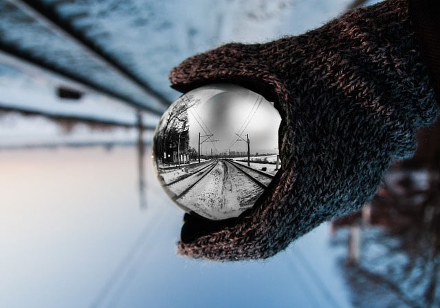 Upside down landscape viewed through sphere so it appears upright